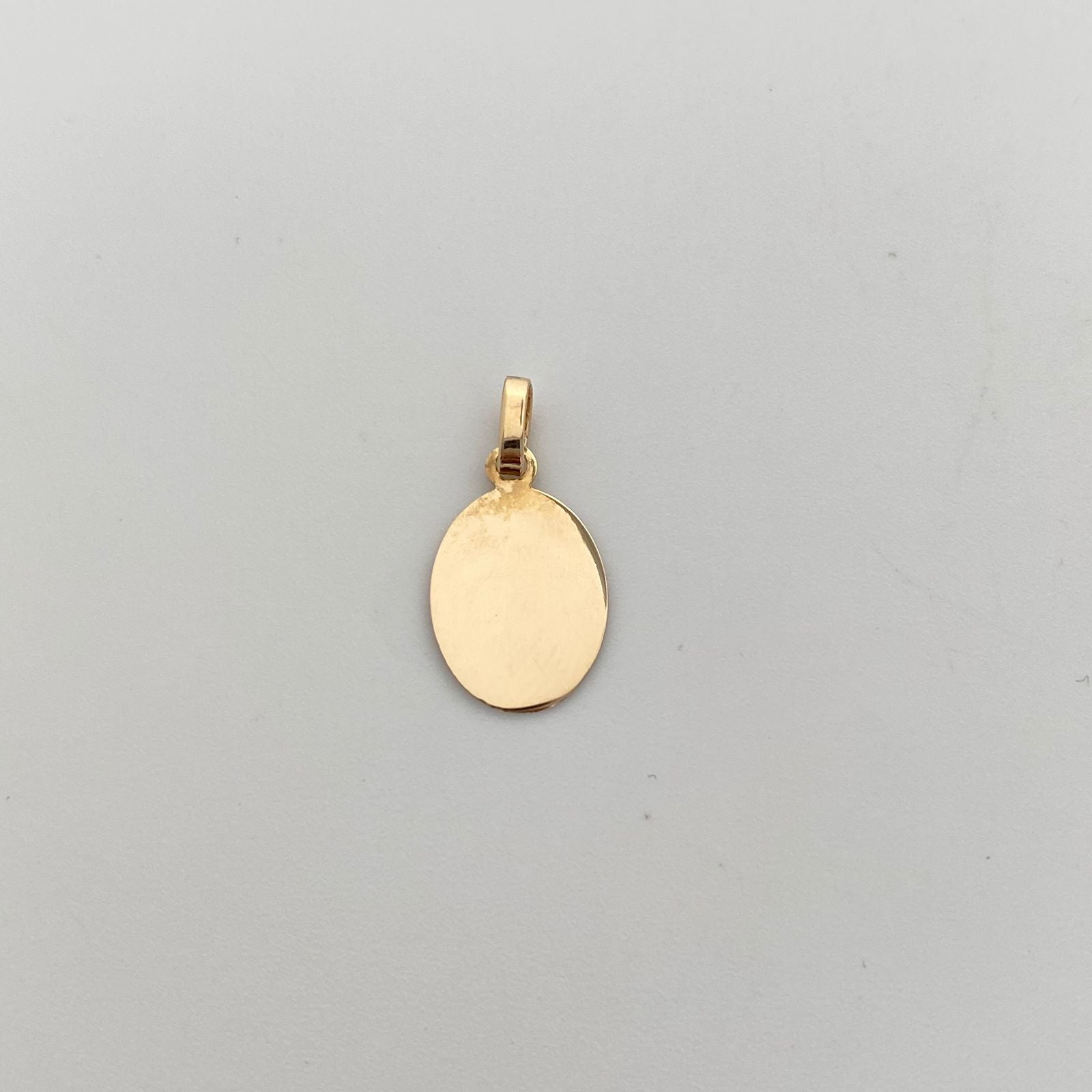 Dije Placa Ovalada Oro amarillo 18k 0,65 Gr / 9,8 mm / 2 Cm