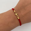 Pulsera tejida Herraje cruz bola diamantada 4mm Hilo rojo Oro amarillo 18k 0,6 Gr