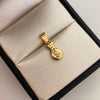 Dije Bolsa de Valores Oro amarillo 18k 0,55 Gr / 7,7 mm / 2 Cm