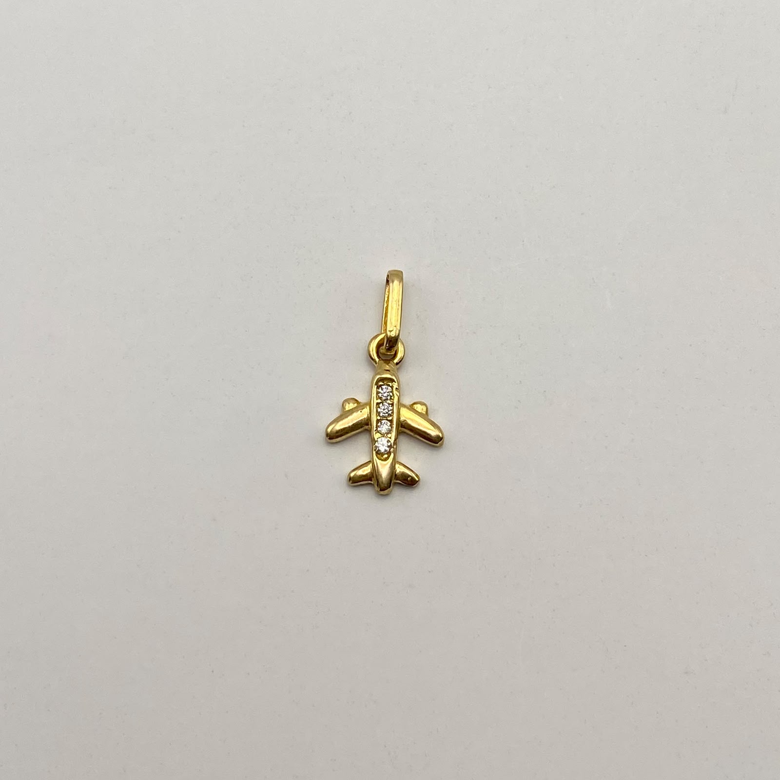 Dije Avion casting Oro amarillo 18k 0,85 Gr / 9,3 mm / 1,6 Cm