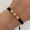 Pulsera tejida Bolas de fuego casting rosada bolas diamantadas 5,6 y 4mm Oro amarillo 18k 1,05 Gr