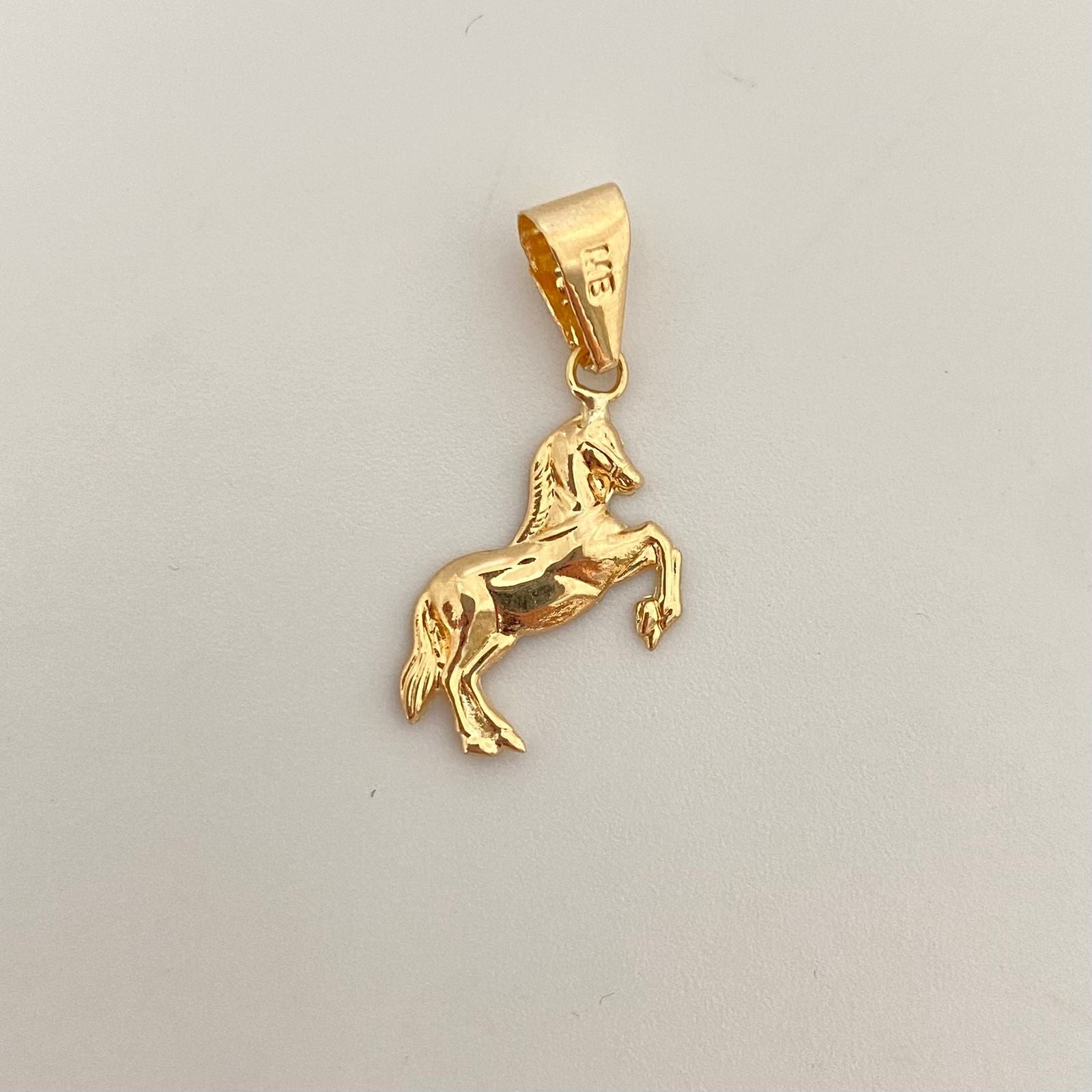 Dije caballo Oro amarillo 18k 0,6 Gr / 2,5 Cm