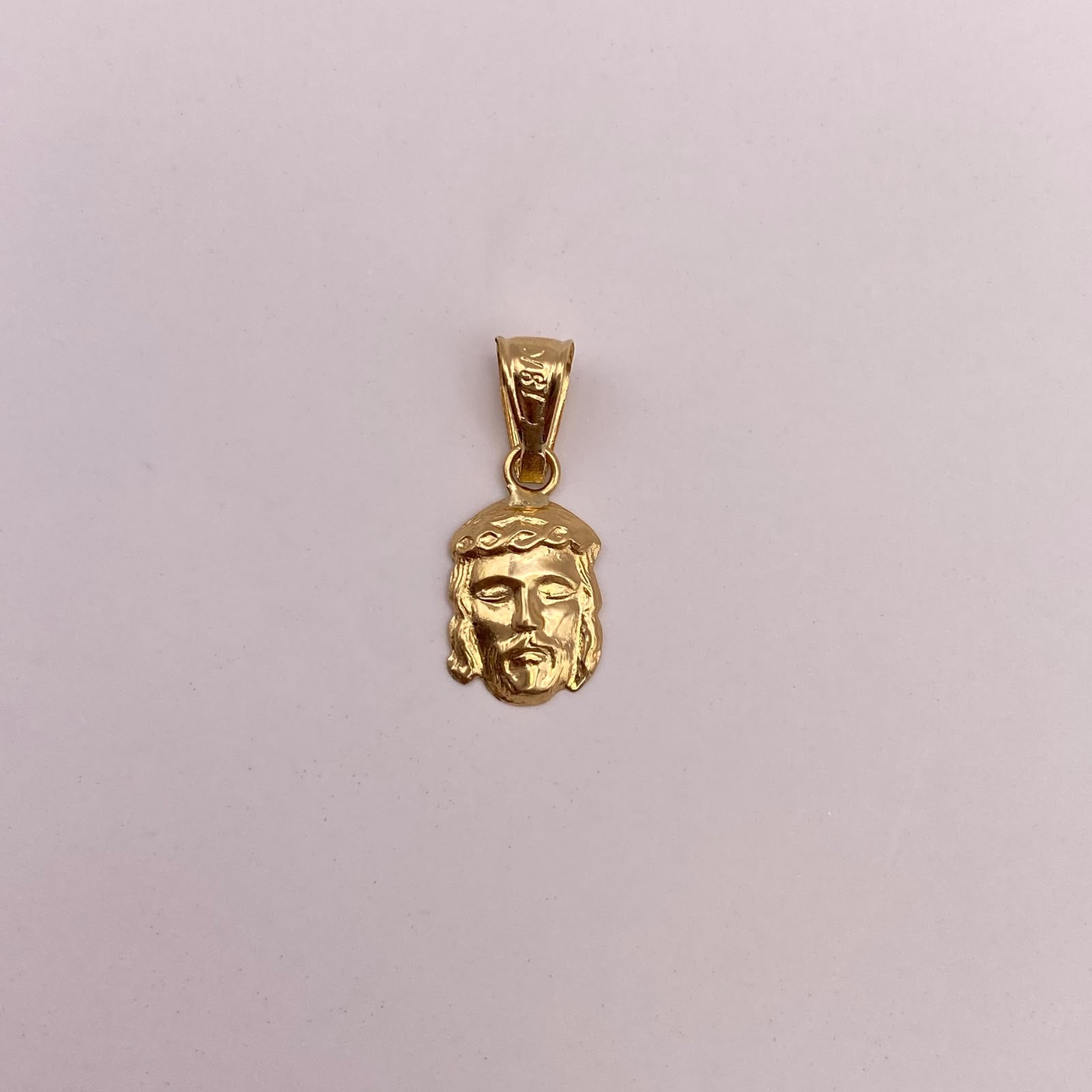 Dije Rostro cristo Oro amarillo 18k 0,54 Gr / 8 mm / 2 Cm