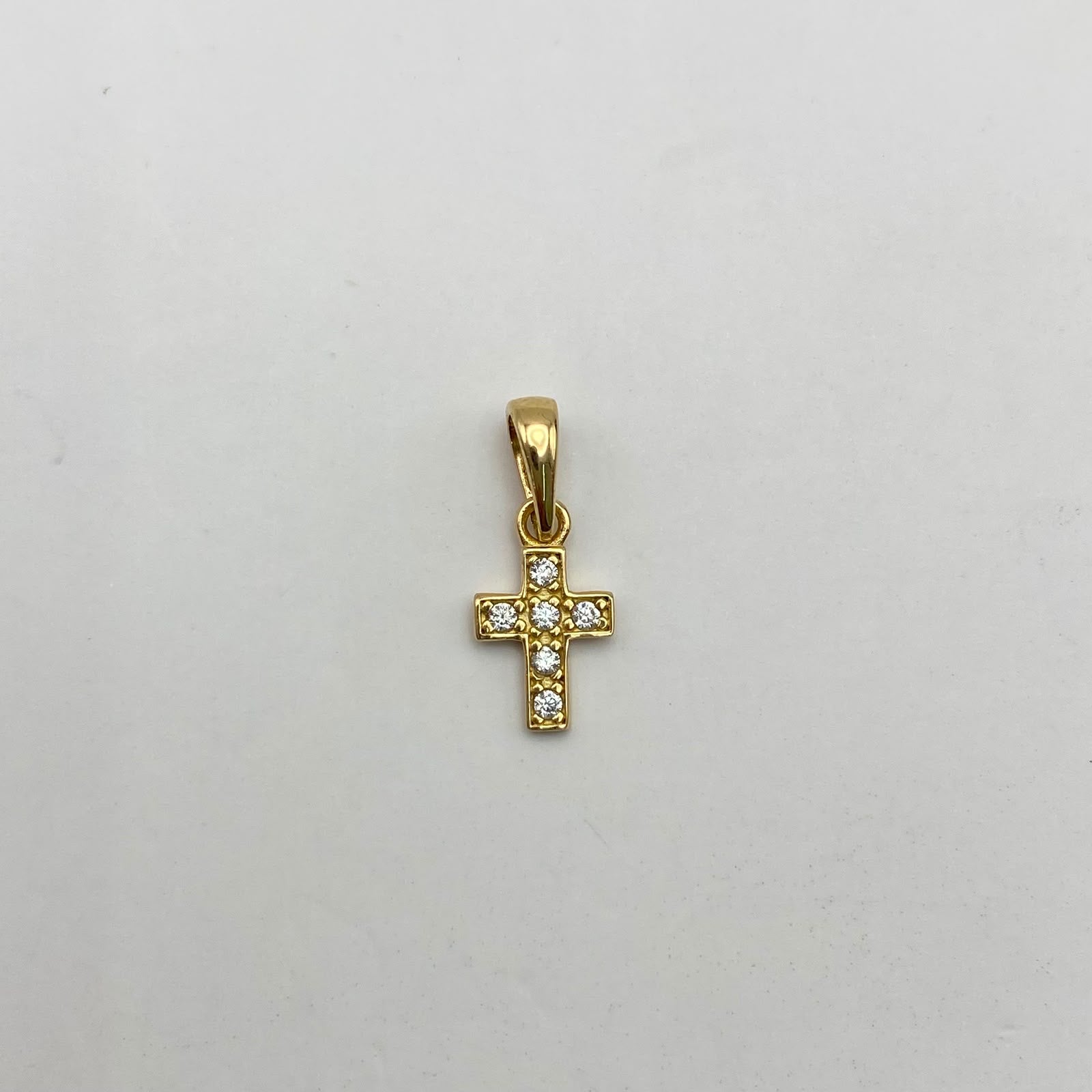 Dije mini cruz circones blancos Oro amarillo 18k 0,5 Gr / 6,4 mm / 1,5 Cm