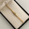 Pulsera tejida  balines #6 lisos y balines #5 diamantados y bola de fuego beige  Oro amarillo 18k 1,95 Gr