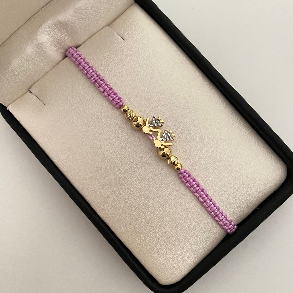 Pulsera tejida con herraje de niñas y circones blancos con balines lisos y diamantados 5mm 4mm y 3mm  Oro amarillo 18k 1,5 Gr