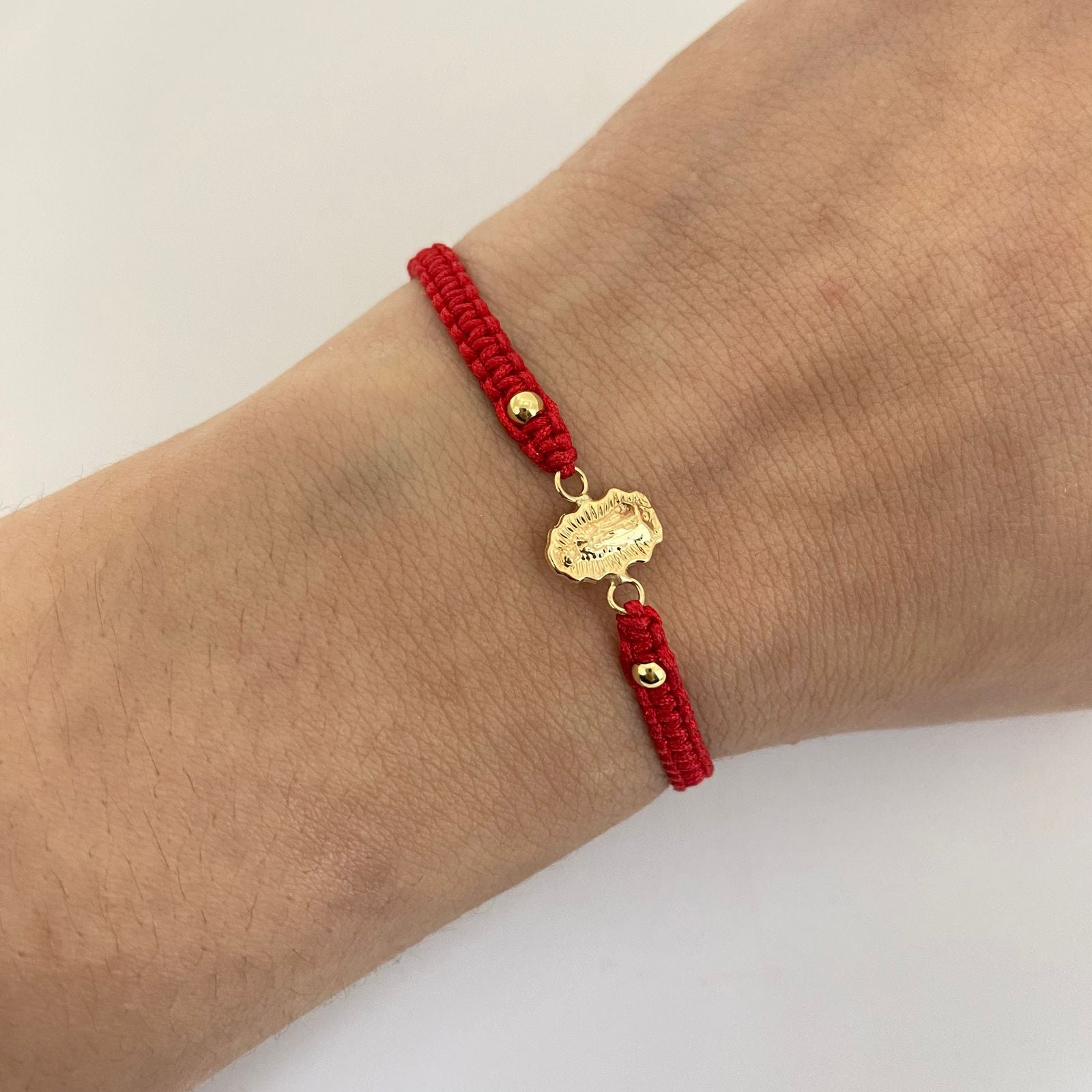 Pulsera tejida con herraje virgen de guadalupe con bolas 3mm lisas  Oro amarillo 18k 0,6 Gr
