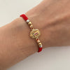 Pulsera tejida con herraje de virgen de guadalupe y balines lisos y diamantados 4mm Tres oros 18k 2,25 Gr