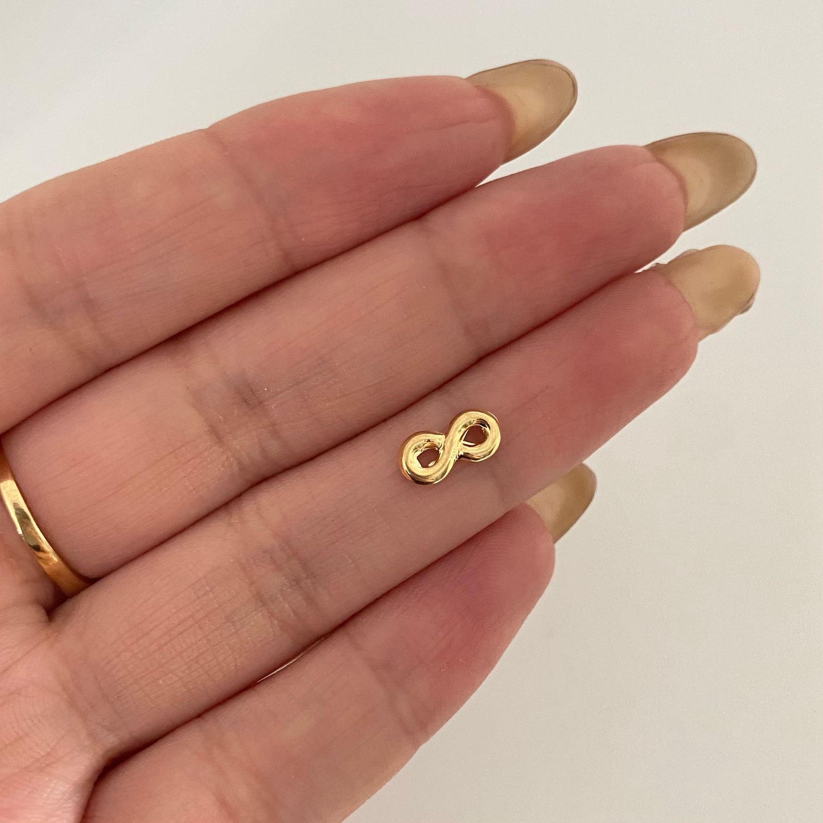 Dije infinito liso Oro amarillo 18k 0,2 Gr / 1,0 Cm