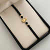Pulsera tejida Bolsa de valores bolas diamantadas 4mm negro Oro amarillo 18k 0,6 Gr