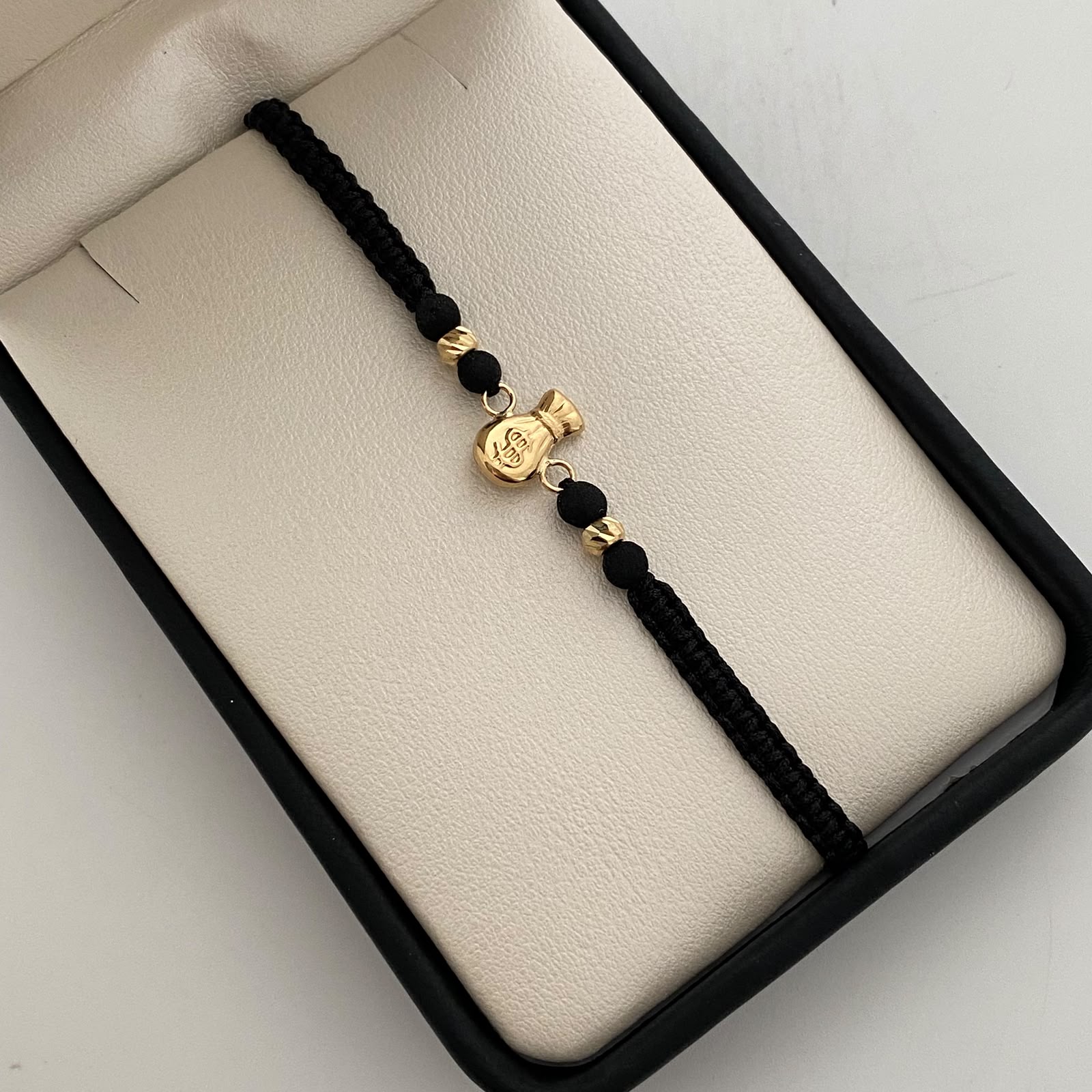 Pulsera tejida Bolsa de valores bolas diamantadas 4mm negro Oro amarillo 18k 0,6 Gr