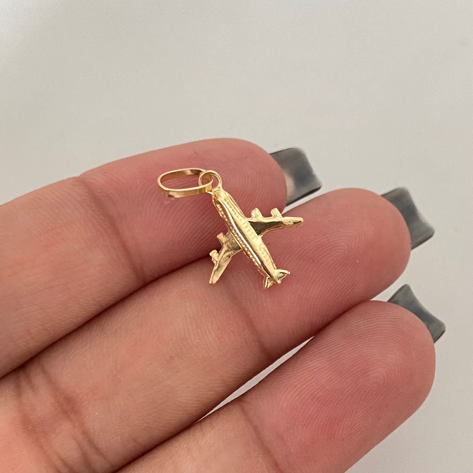Dije avión Oro amarillo 18k 0,45 Gr / 2,0 Cm