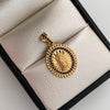 Dije Redondo Casting Negro Virgen de Guadalupe Oro amarillo 18k 2,75 Gr / 15,9 mm / 2,6 Cm