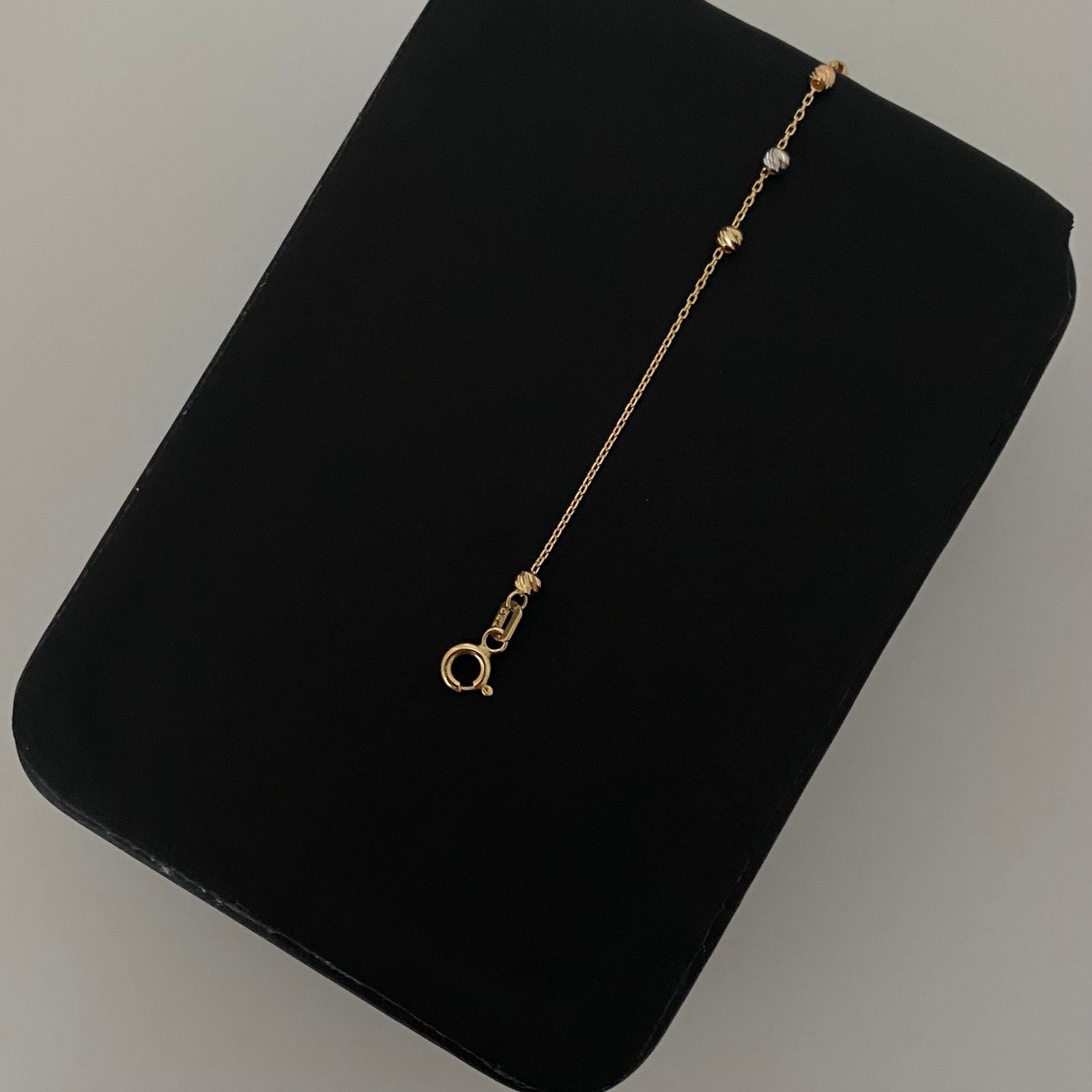 Pulso It cruz lisa balines diamantados Tres oros 18k +4 / 1,25 Gr / 2,5 mm / 19 Cm