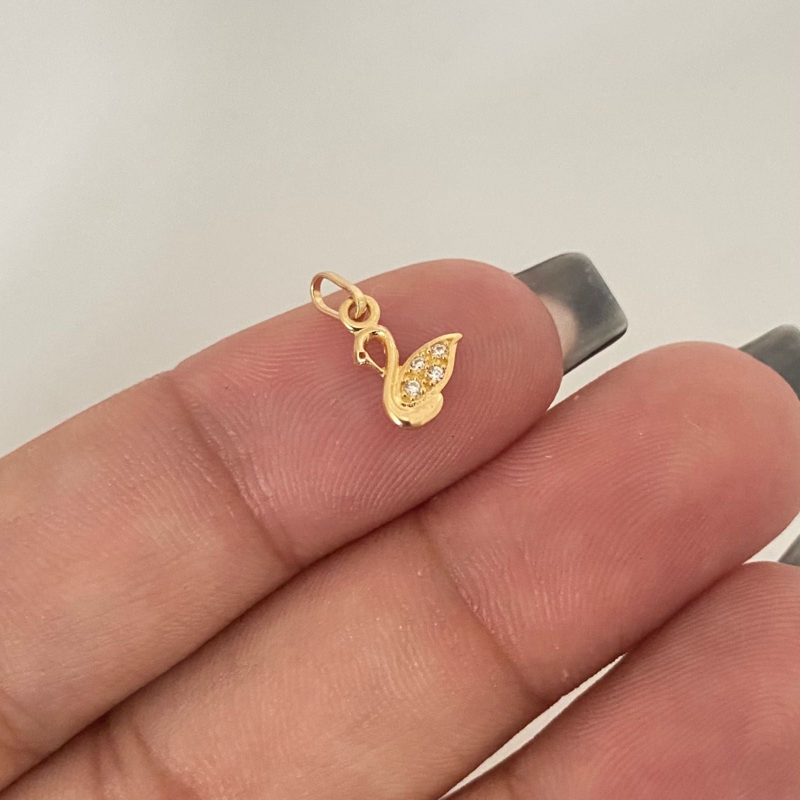 Dije mini cisne casting Oro amarillo 18k 0,35 Gr / 1,2 Cm