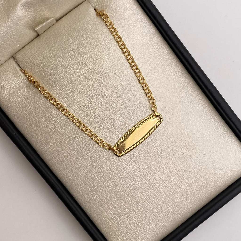 Pulso bebé aro seguido placa ovalo borde Oro amarillo 18k 1,33 Gr / 14,5 Cm  Broche 0,20