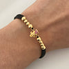 Pulsera tejida con herraje tio rico con circones rosados y bolas lisas 5mm y 4mm  Oro amarillo 18k 2 Gr