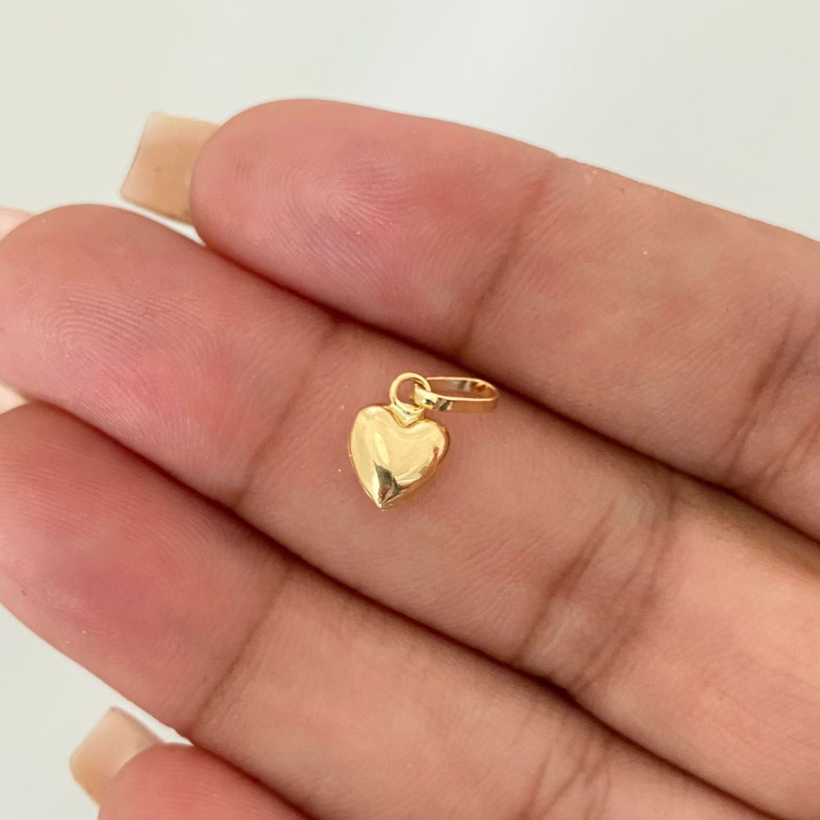 Dije corazon soplado Oro amarillo 18k 0,35 Gr / 1,3 Cm