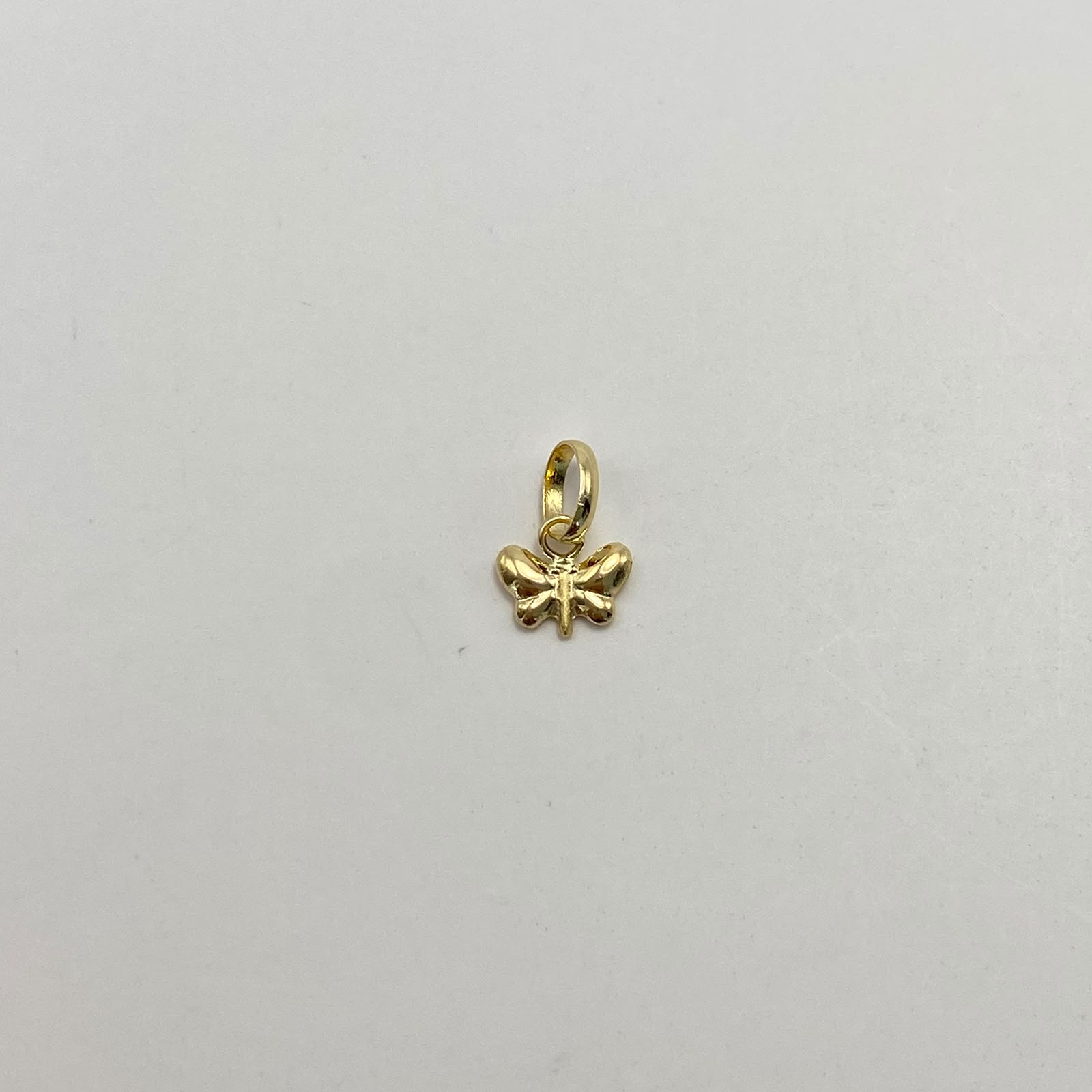 Dije Mariposita Oro amarillo 18k 0,25 Gr / 7,2 mm / 1 Cm