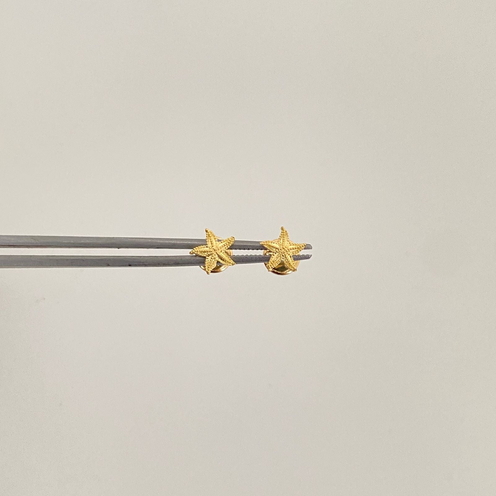 Topos estrella de mar diamantada Oro amarillo 18k 0,8 Gr / 6,5 mm