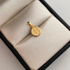 Dije San Benito Oro amarillo 18k 0,45 Gr / 8,4 mm / 1,5 Cm