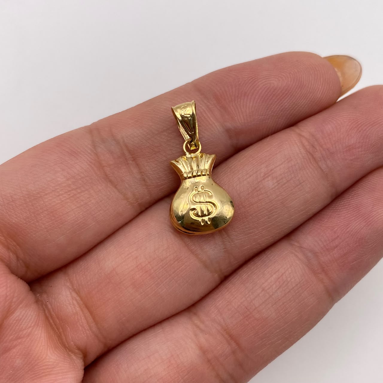 Dije bolsa dinero Oro amarillo 18k 0,8 Gr / 10,3 mm / 2 Cm