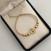 Pulsera tejida herraje virgen de guadalupe casting balines #5 diamantados y lisos beige Oro amarillo 18k 2,9 Gr