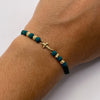 Pulsera tejida Herraje cruz lisa bolas diamantadas 4mm hilo verde  Oro amarillo 18k 0,45 Gr