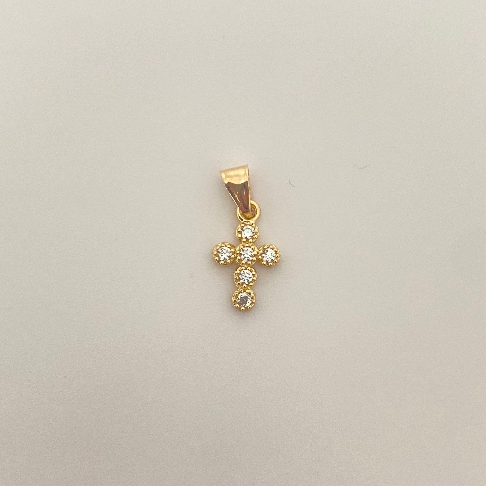 Dije mini cruz casting Oro amarillo 18k 0,50 Gr / 1,5 Cm