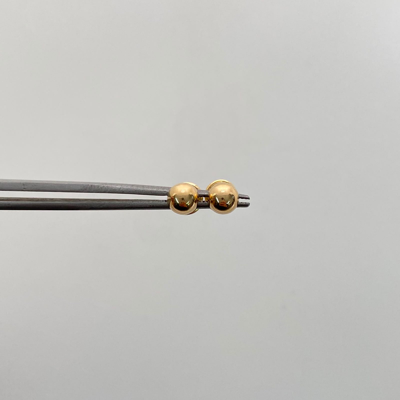 Topos Bola Lisa 5mm Oro amarillo 18k 0,55 Gr