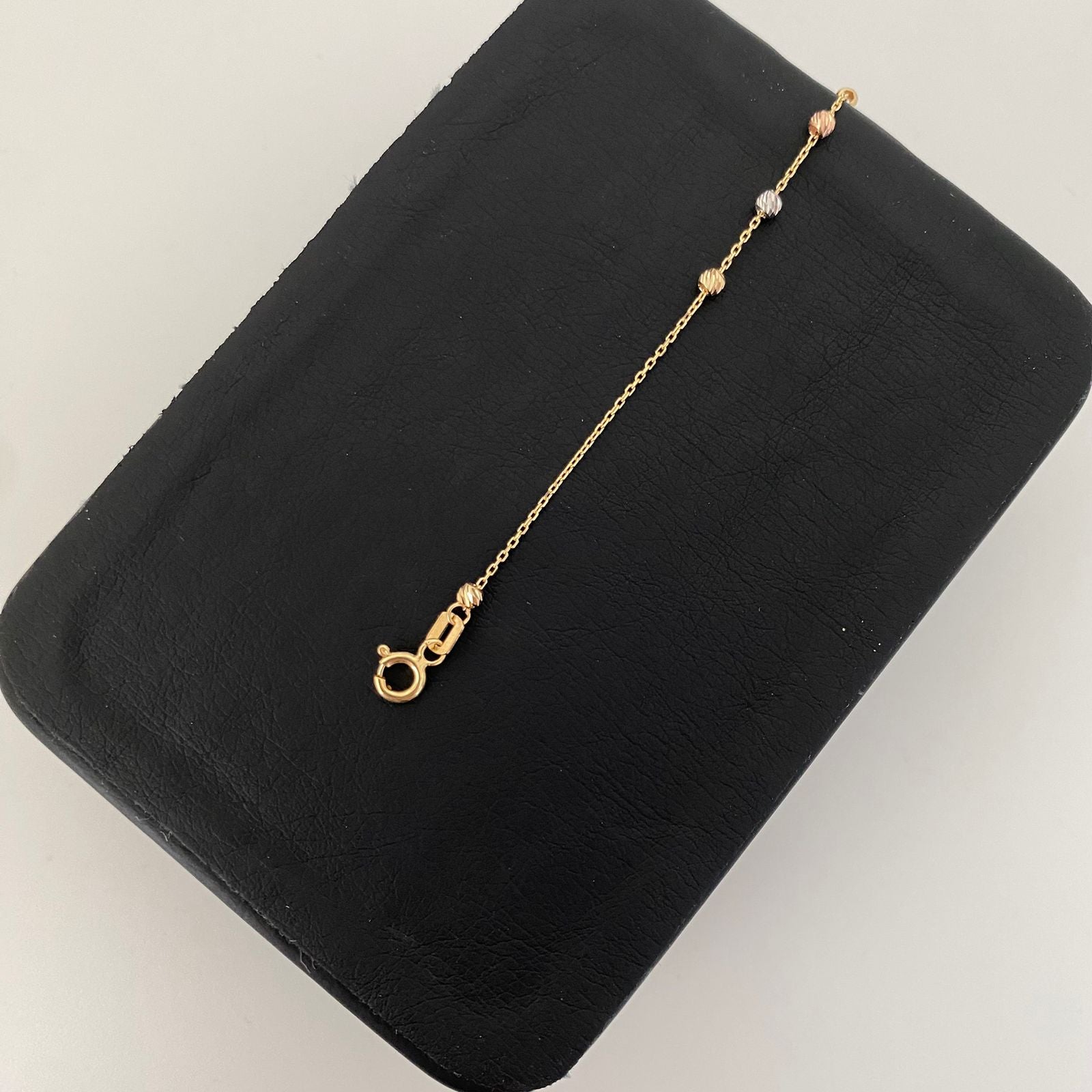 Pulso It balines diamantados cruz lisa Tres oros 18k +4 / 1,25 Gr / 2,5 mm / 19 Cm