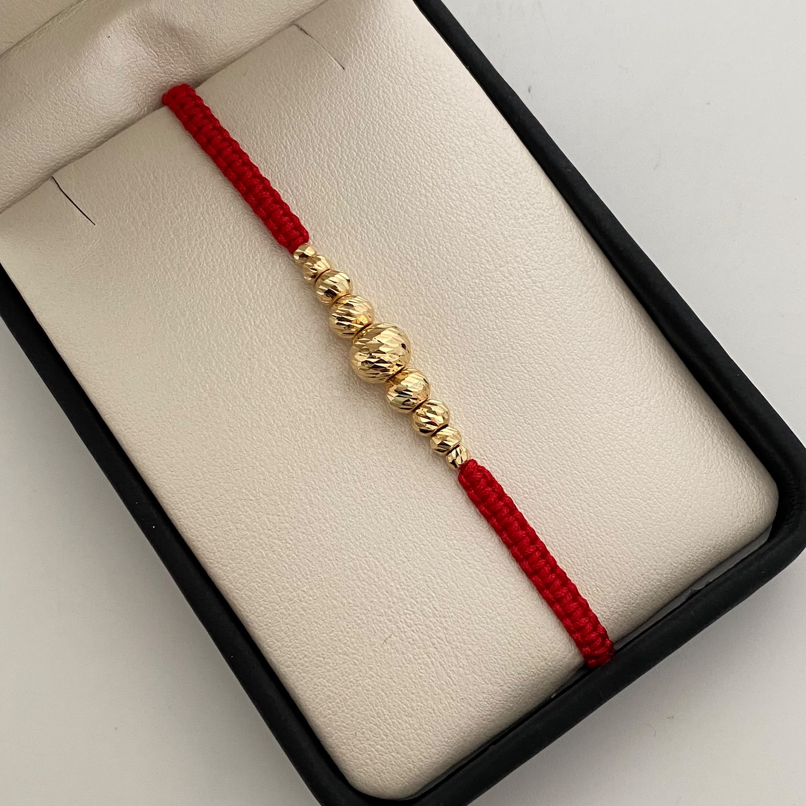 Pulsera tejida Bolas Diamantadas 8,6,5,4,3 mm roja Oro amarillo 18k 0,85 Gr