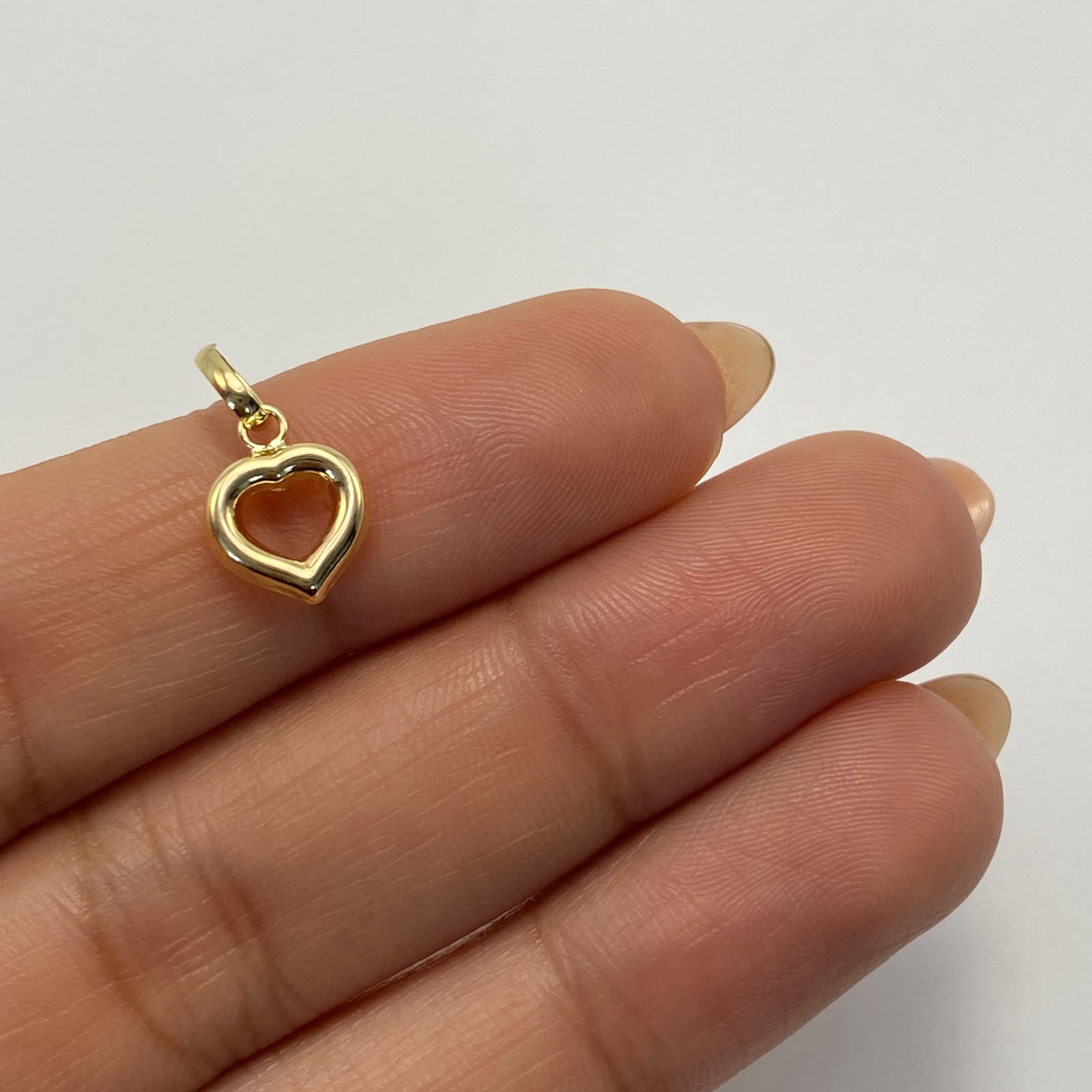 Dije Corazon silueta Oro amarillo 18k 0,4 Gr / 8,5 mm / 1,4 Cm