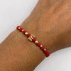 Pulsera tejida Herraje letra E bolas diamantadas 4mm y 3mm  Oro amarillo 18k 1,04 Gr