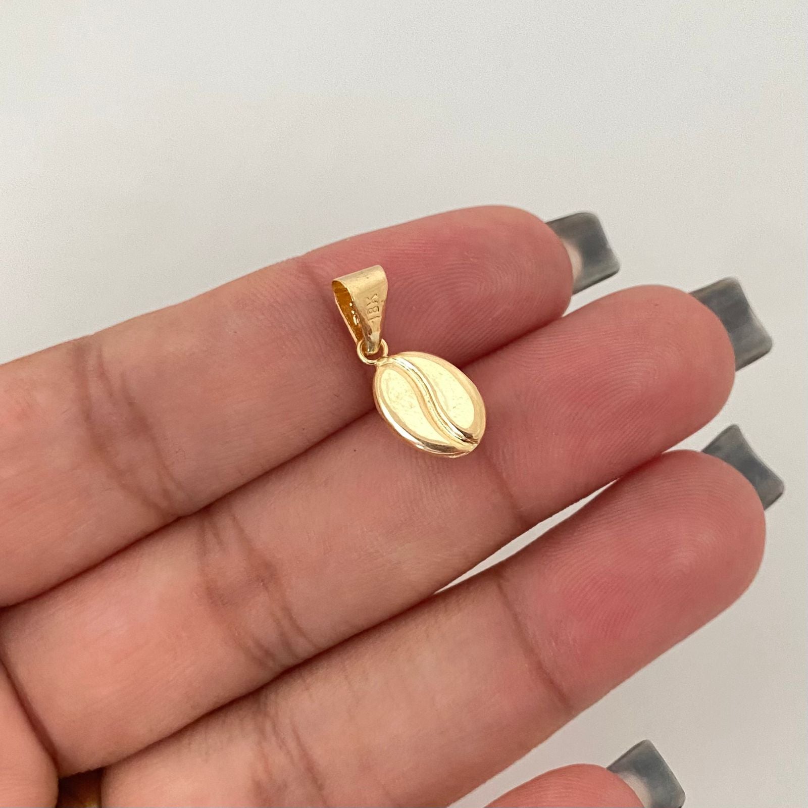 Dije grano de café Oro amarillo 18k 0,65 Gr / 2,0 Cm