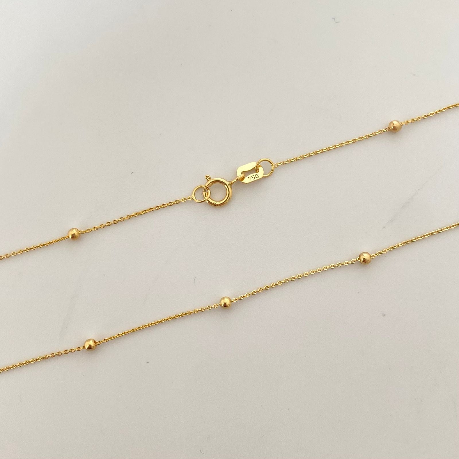 Cadena It aro seguido balines lisos Oro amarillo 18k +1 / 1,5 Gr / 2,0 mm / 40 Cm