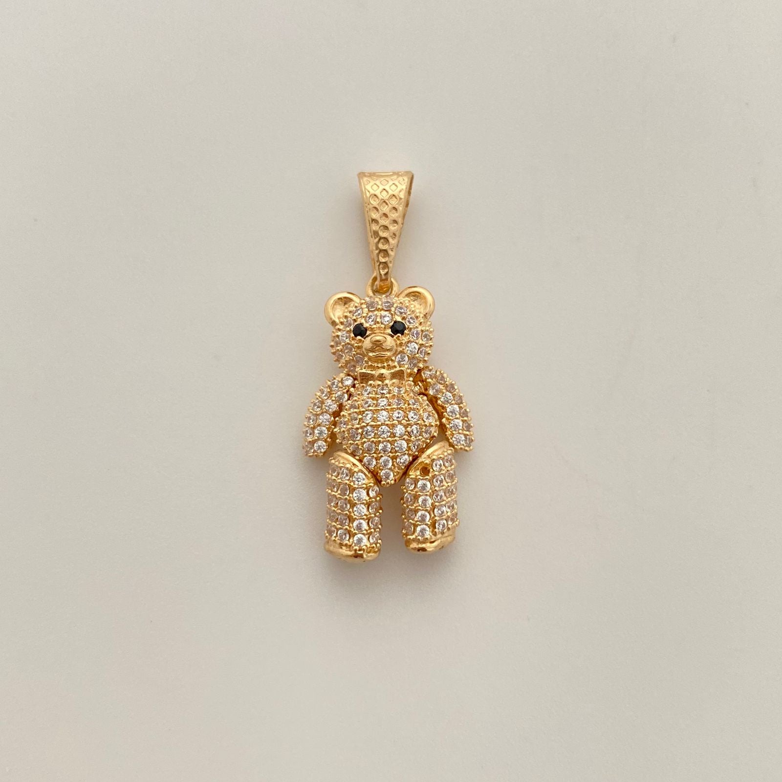 Dije oso articulado con circones blancos y negros  Oro amarillo 18k 5,4 Gr / 15,4 mm / 3,1 Cm