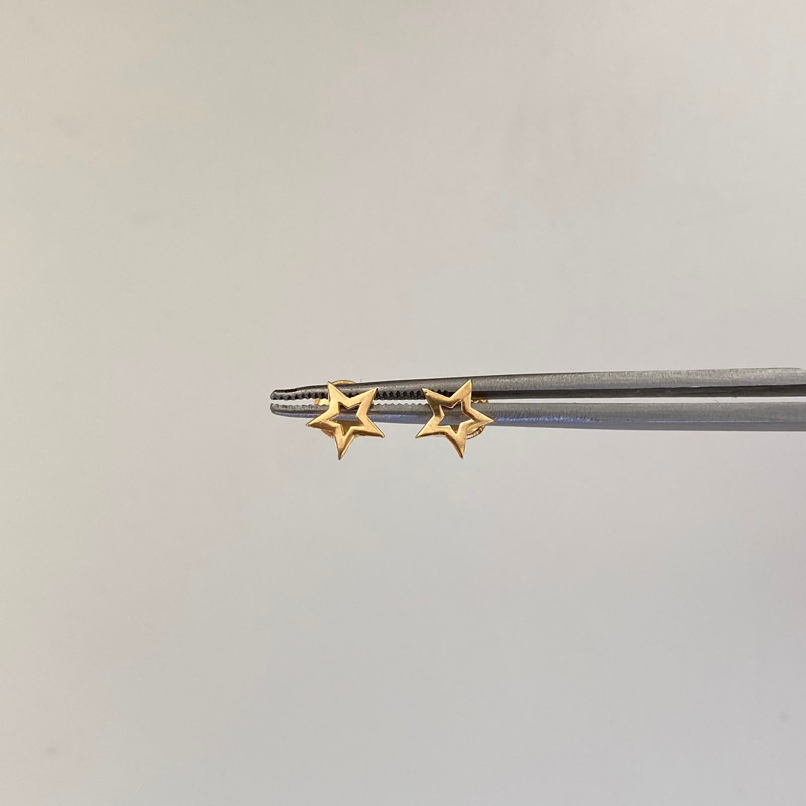 Topos Estrella Silueta Oro amarillo 18k 0,6 Gr / 7,2 mm