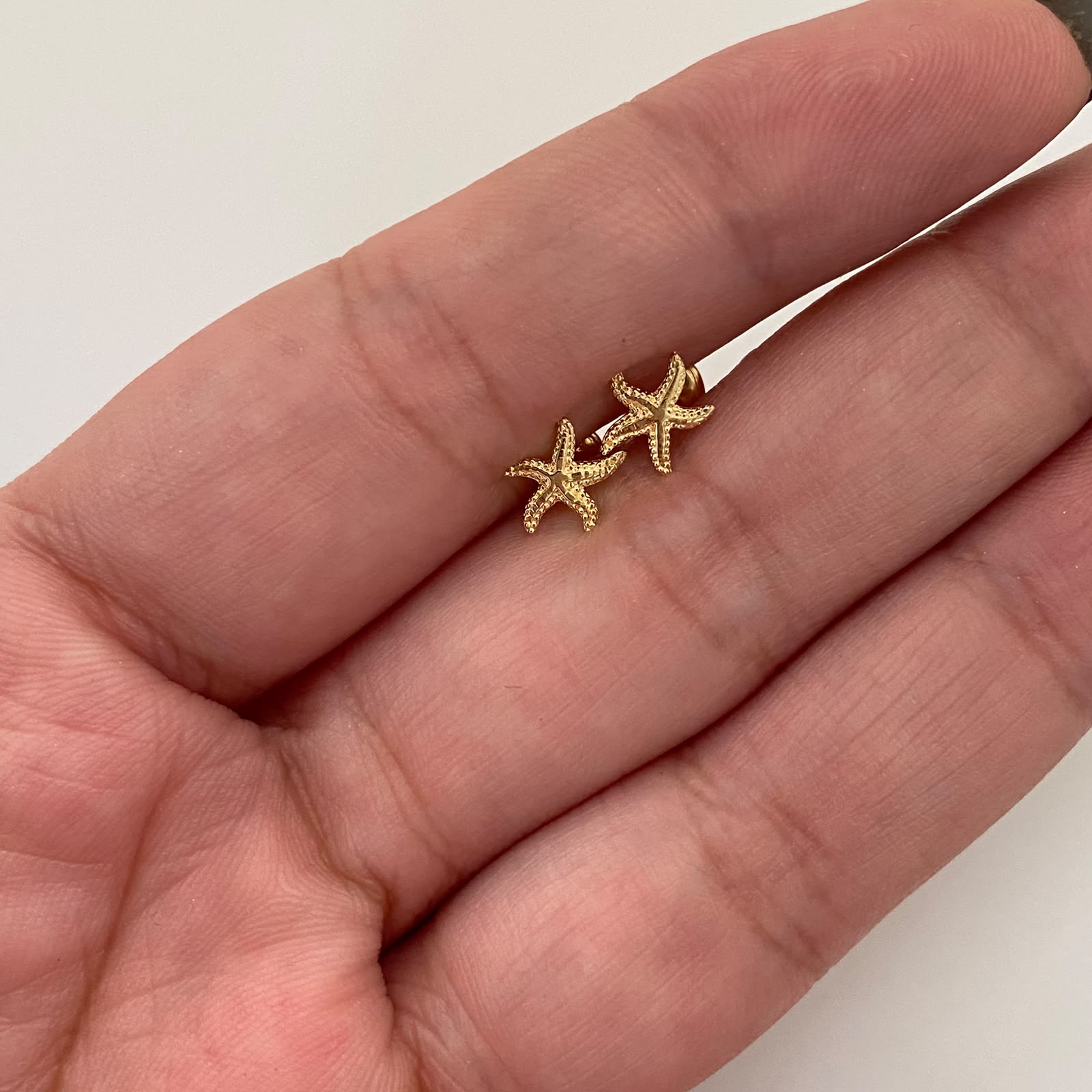 Topos estrella de mar relieves Oro amarillo 18k 0,75 Gr / 7 mm