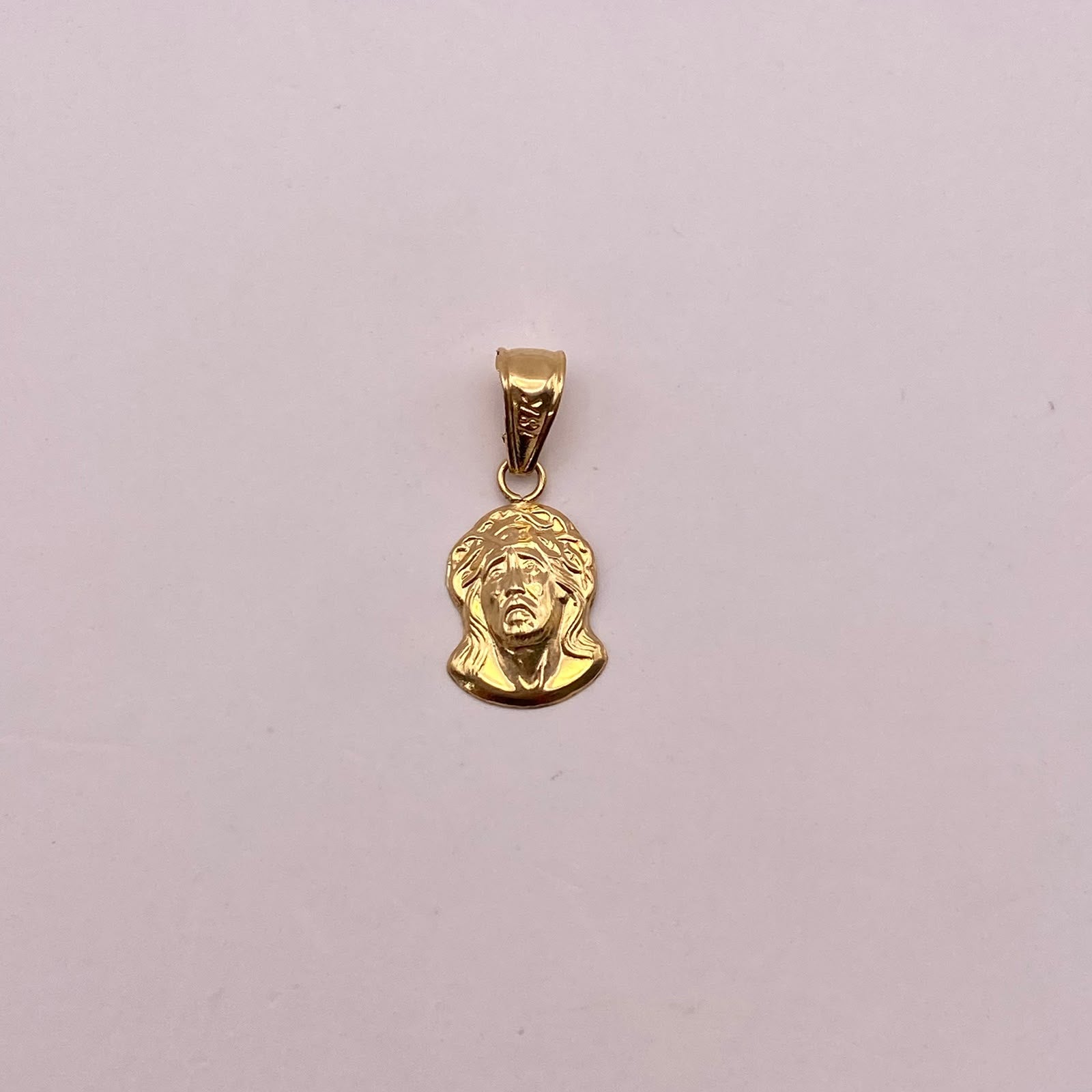 Dije rostro cristo Oro amarillo 18k 0,54 Gr / 7,9 mm / 2 Cm