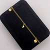 Tobillera aro seguido dijes Oro amarillo 18k 3,40 Gr / 27 Cm  Broche 0,40