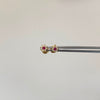 Topos flor centro fucsia Oro amarillo 18k 0,6 Gr