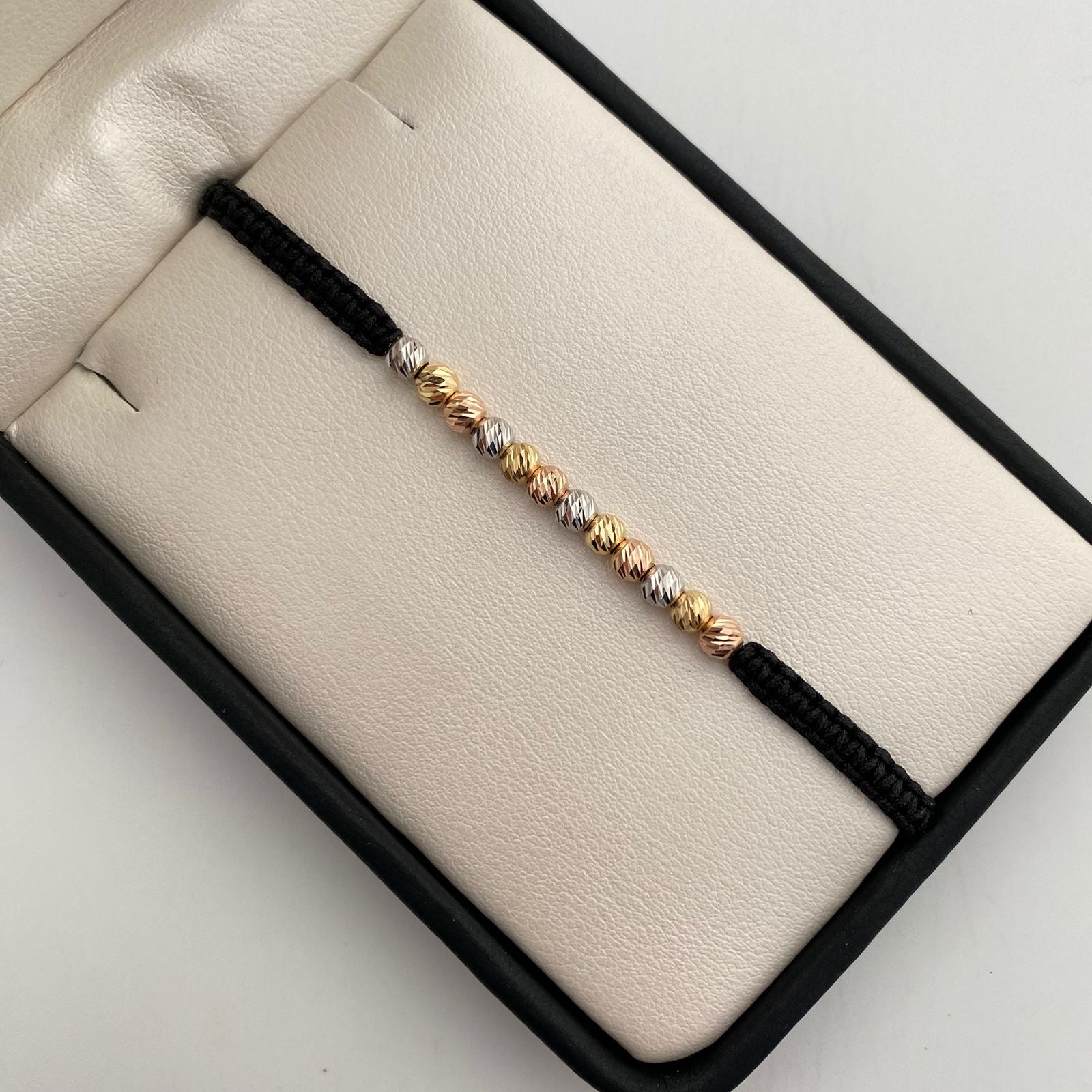 Pulsera tejida con balines diamantados 3mm  Tres oros 18k 0,75 Gr