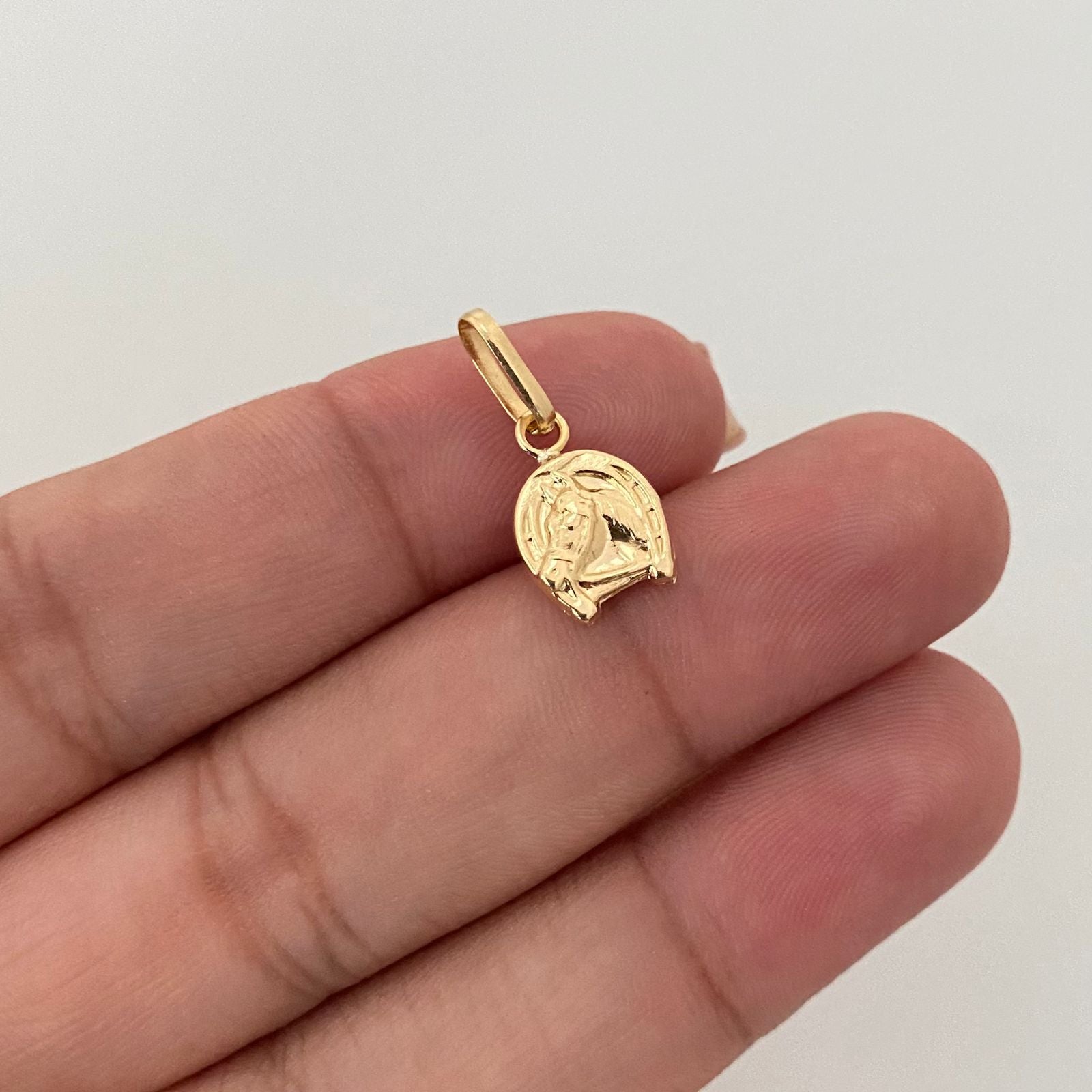 Dije herradura caballo Oro amarillo 18k 0,65 Gr / 2,0 Cm