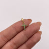 Dije mini cruz circones verdes Oro amarillo 18k 0,55 Gr / 7,68 mm / 1,5 Cm