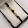 Pulsera tejida Bolas diamantadas 8mm y neoros una raya 8mm Tres oros 18k 1,3 Gr