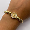 Pulsera tejida Herraje tambor virgen circones blancos bolas lisas 8mm y 6mm Oro amarillo y Oro blanco 18k 5,30 Gr