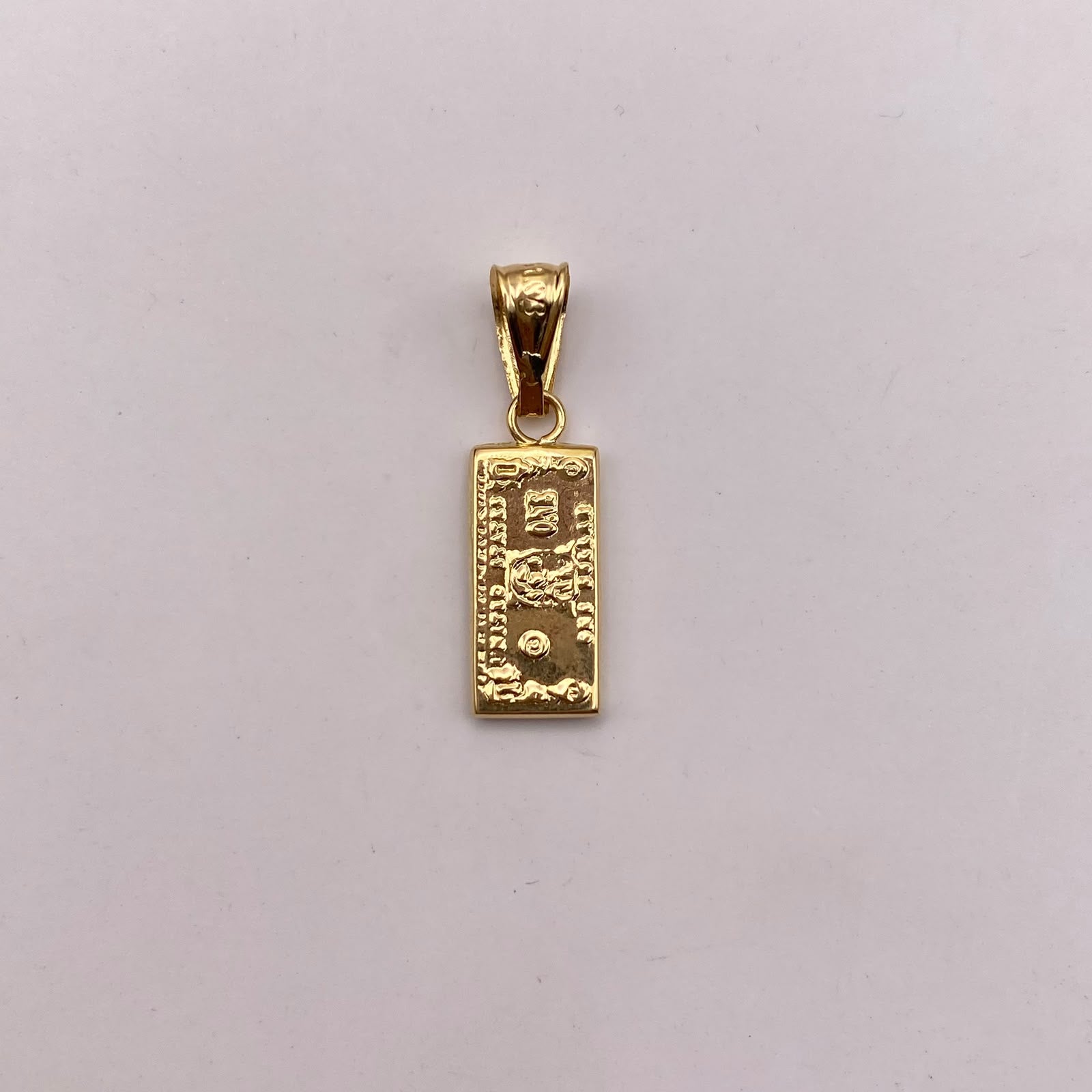 Dije dolar Oro amarillo 18k 0,65 Gr / 6,5 mm / 2,5 Cm