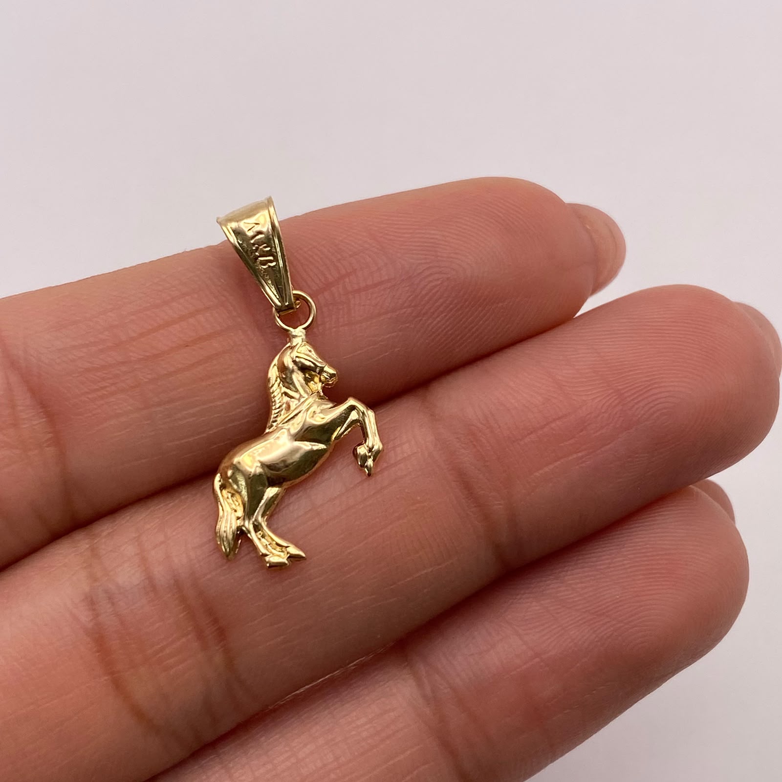 Dije Caballo silueta Oro amarillo 18k 0,57 Gr / 12,4 mm / 2,5 Cm