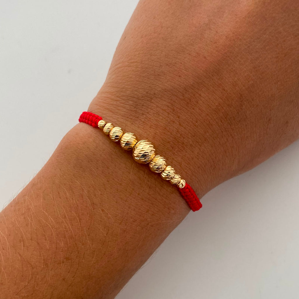 Pulsera tejida Bolas Diamantadas 8,6,5,4,3 mm roja Oro amarillo 18k 0,85 Gr